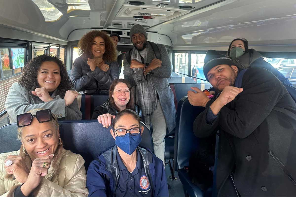  Public Advocate Jumaane Williams throws up the X with his fists across his chest alongside other elected officials and advocates inside an NYC electric school bus during a tour in the Bronx. 