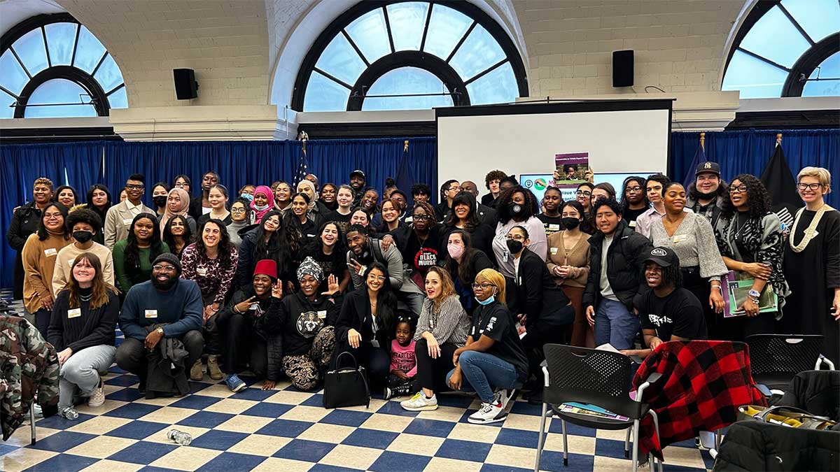 Youth Agenda Policy Breakfast, with Council Member Althea Stevens and the Public Advocate posing with a large group of young people. 