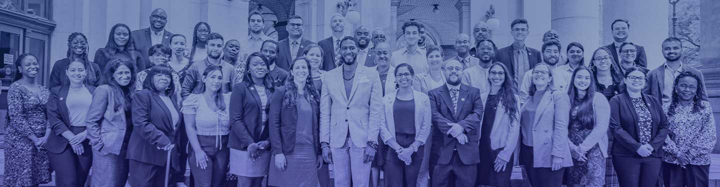 Public Advocate's Office staff photo, with staff gathered on the steps outside the David N. Dinkins Municipal Building